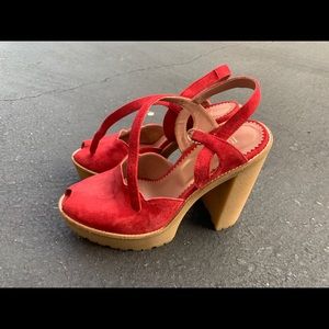 Red suede pumps